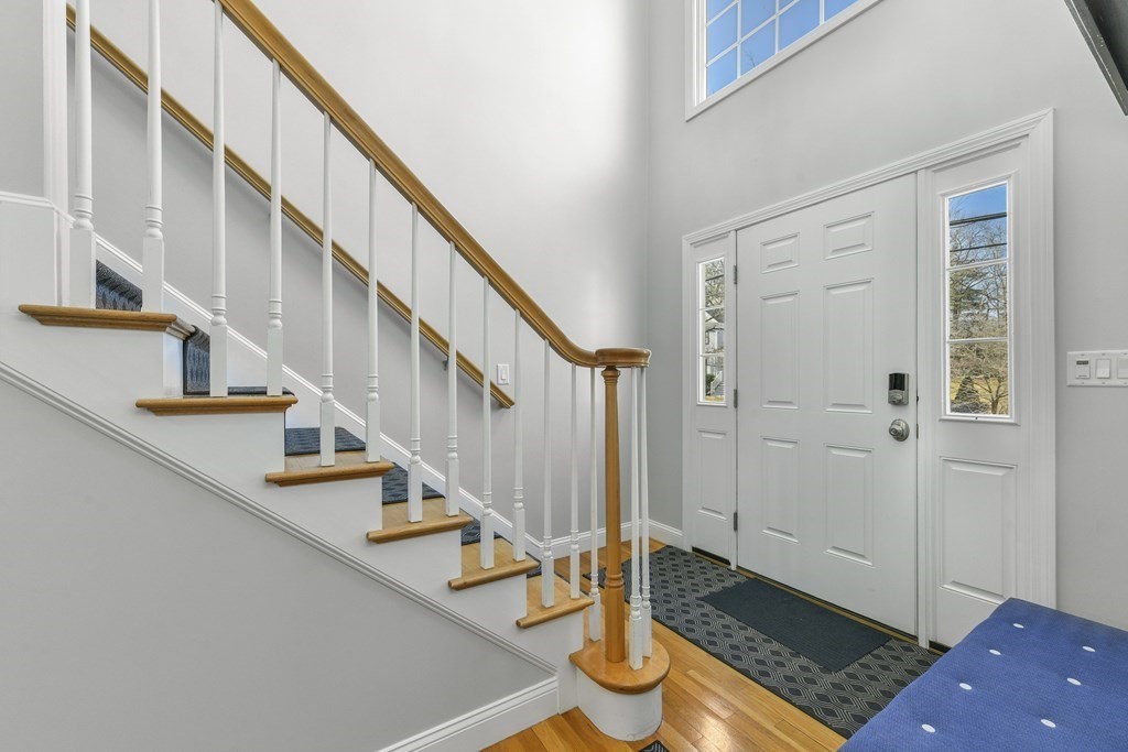 211 Pearl Street Reading, MA 01867 - Photo 4 of 34 a view of entryway with wooden floor and stairs