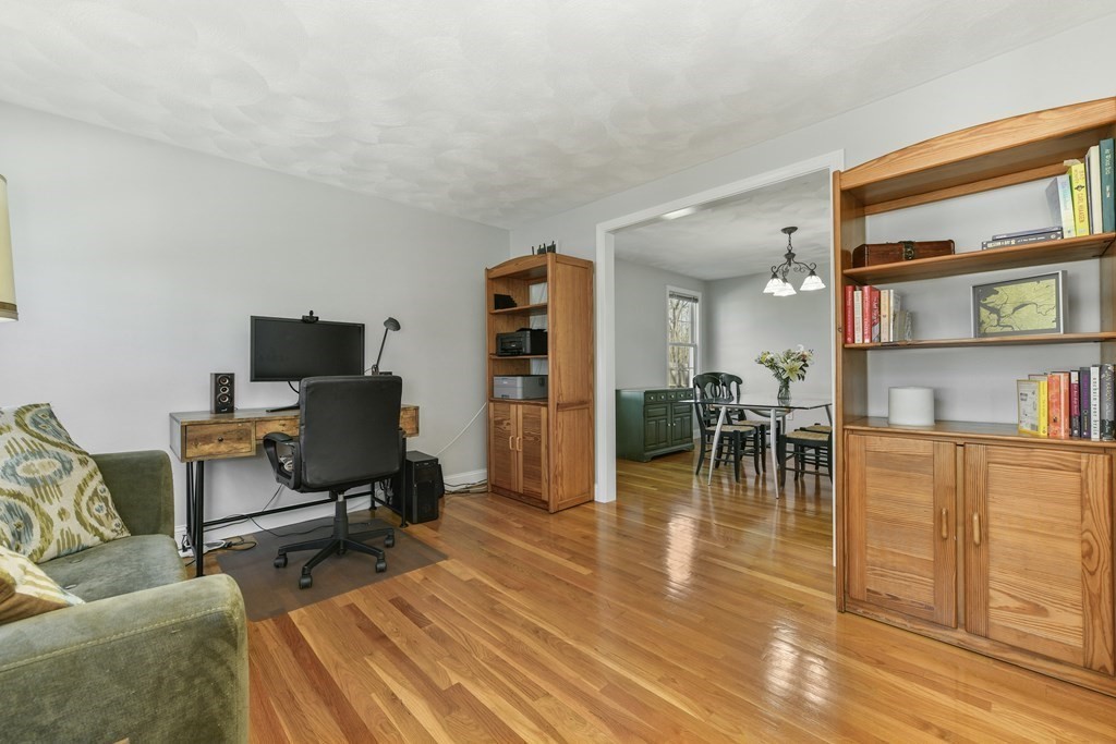 211 Pearl Street Reading, MA 01867 - Photo 5 of 34 a view of a livingroom with furniture and a workspace
