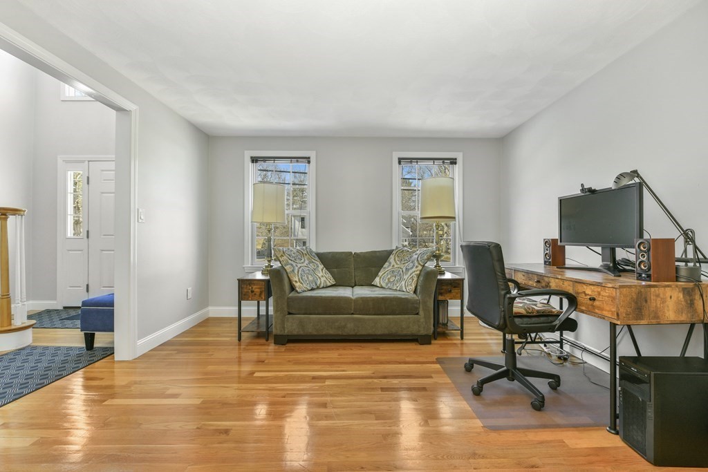 211 Pearl Street Reading, MA 01867 - Photo 6 of 34 a view of a livingroom with workspace and a couch