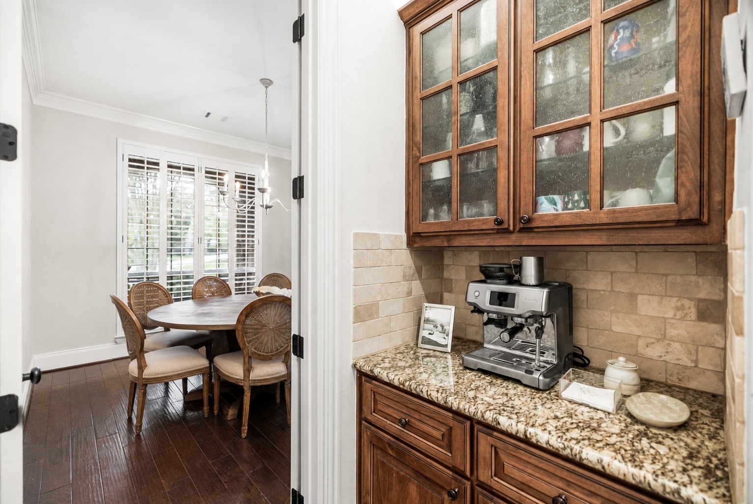 3 Mohawk Path Place Spring, TX 77389 - Photo 16 of 38 Perfectly positioned between the kitchen and dining room, and just steps from the garage entry, the coffee bar offers convenience for a quick grab-and-go morning or a relaxed sit-and-sip moment. It's another thoughtful feature that showcases the home's blend of functionality and elegance.