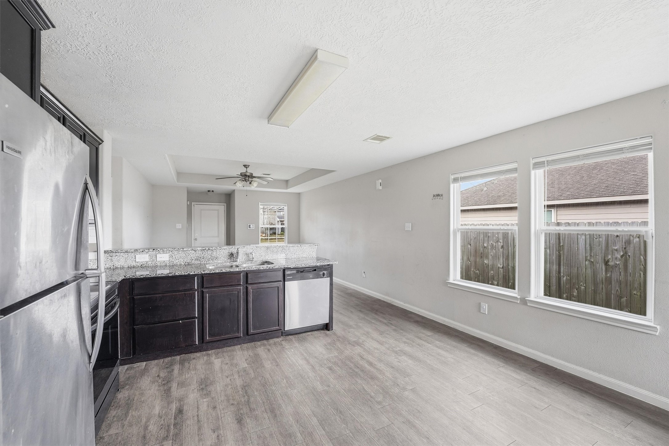 47 Road 5103 Cleveland, TX 77327 - Photo 13 of 33 a kitchen with stainless steel appliances granite countertop a stove and a refrigerator