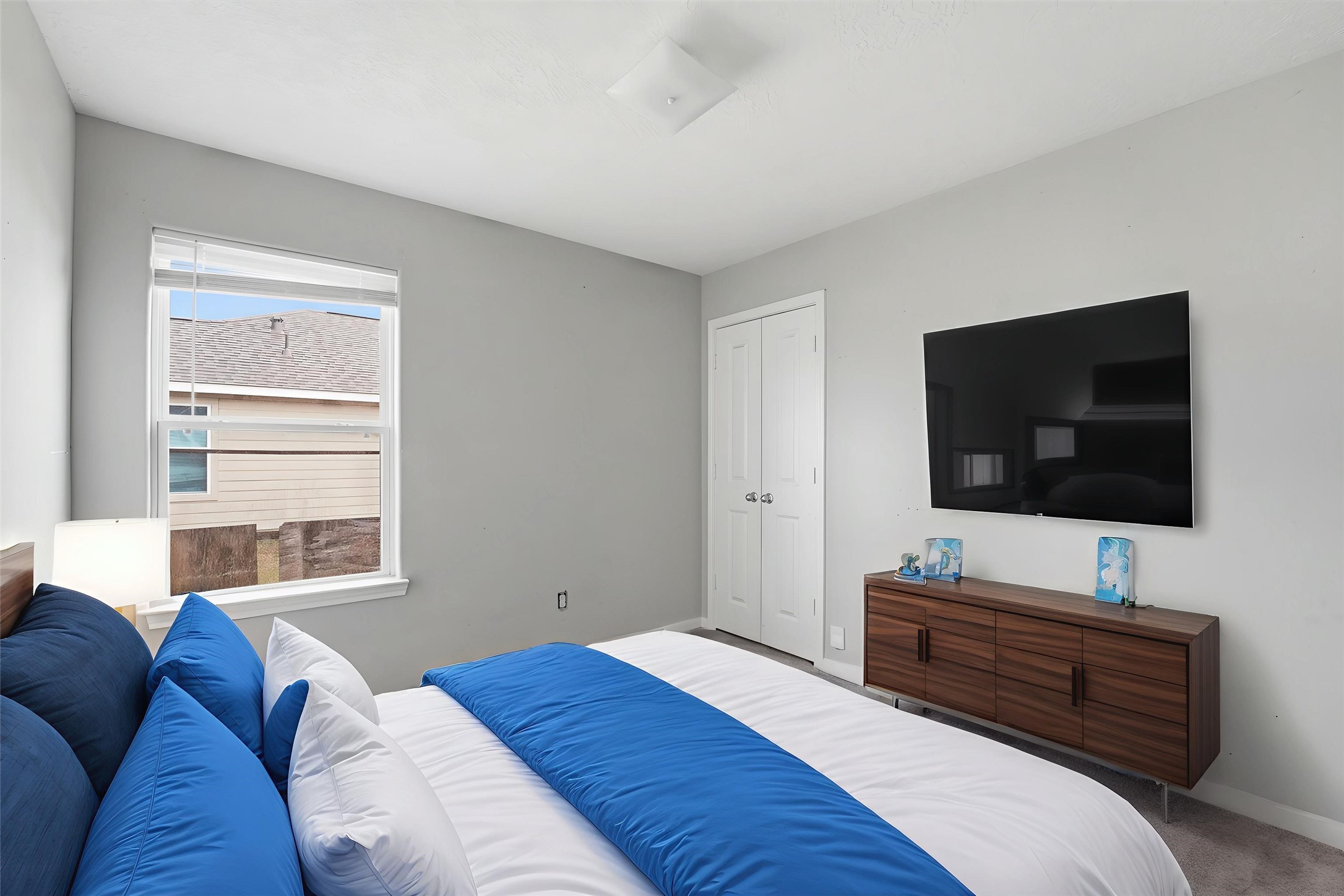 47 Road 5103 Cleveland, TX 77327 - Photo 19 of 33 a bedroom with a bed and a flat screen tv