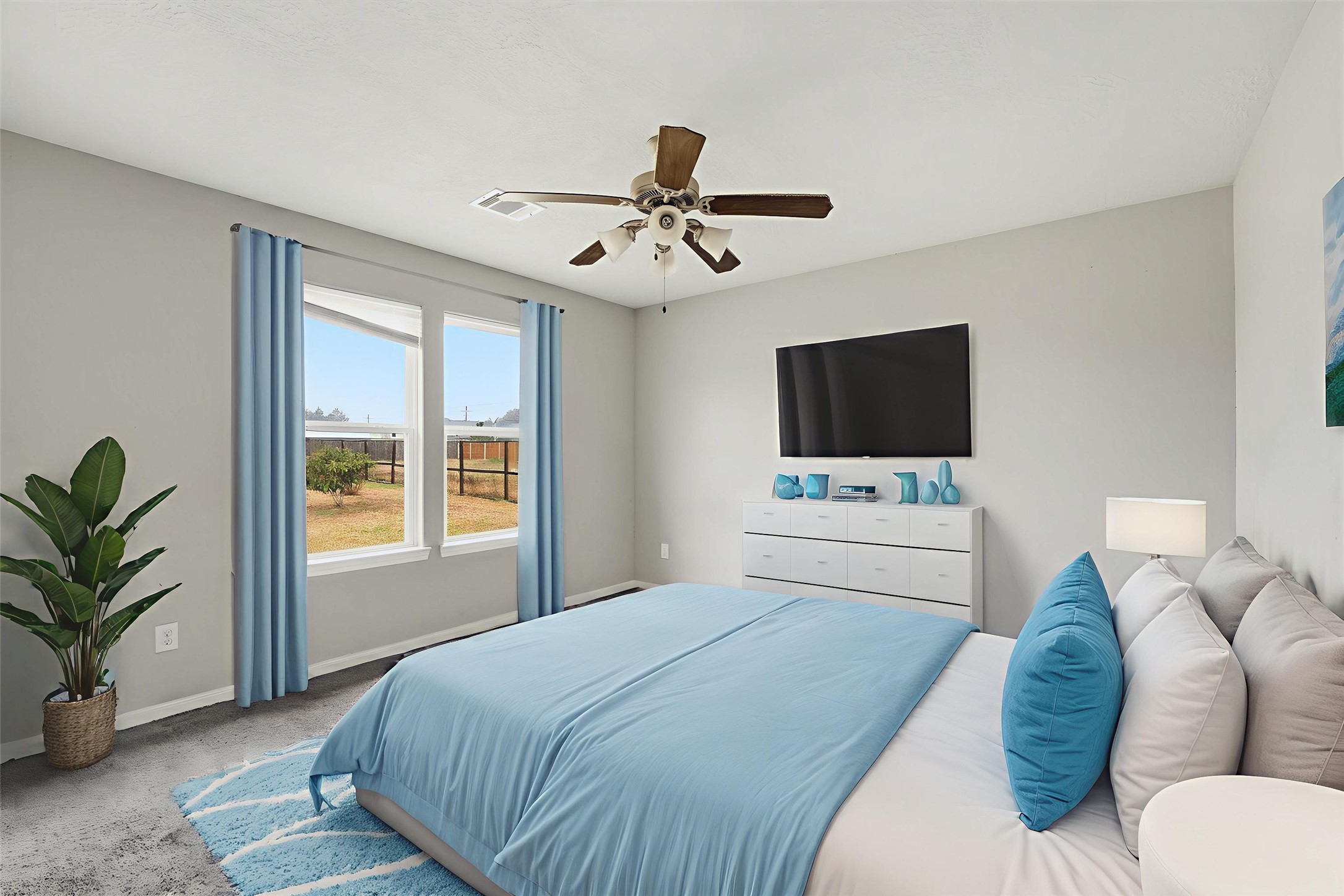 47 Road 5103 Cleveland, TX 77327 - Photo 23 of 33 a bedroom with a bed window and a flat screen tv