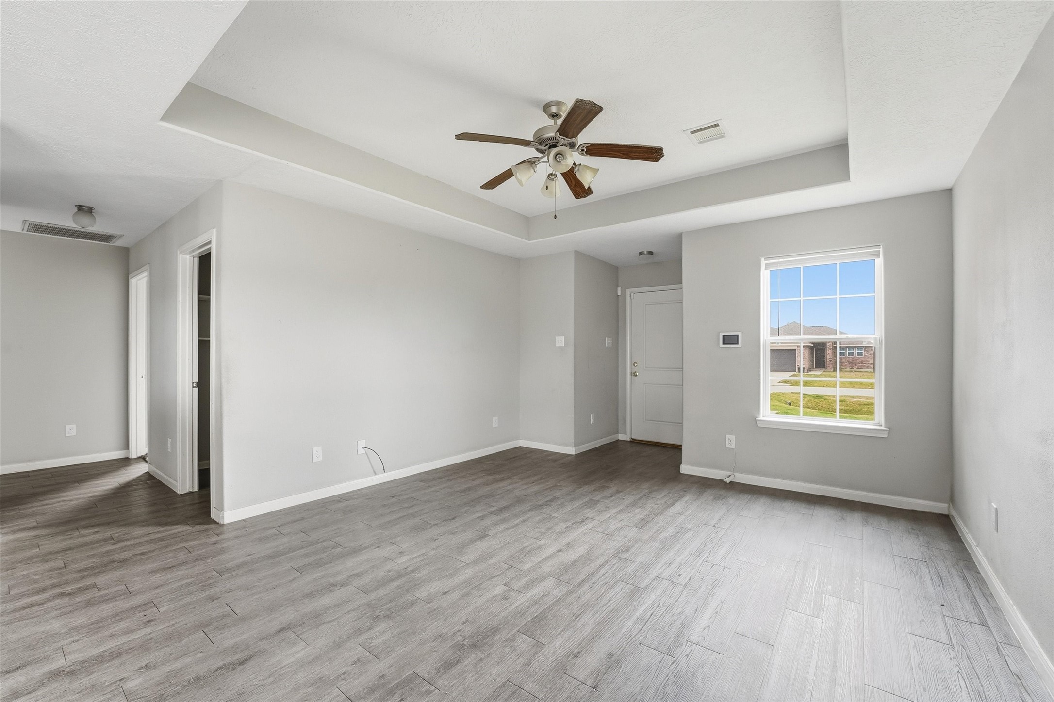 47 Road 5103 Cleveland, TX 77327 - Photo 10 of 33 a view of an empty room with wooden floor and a window