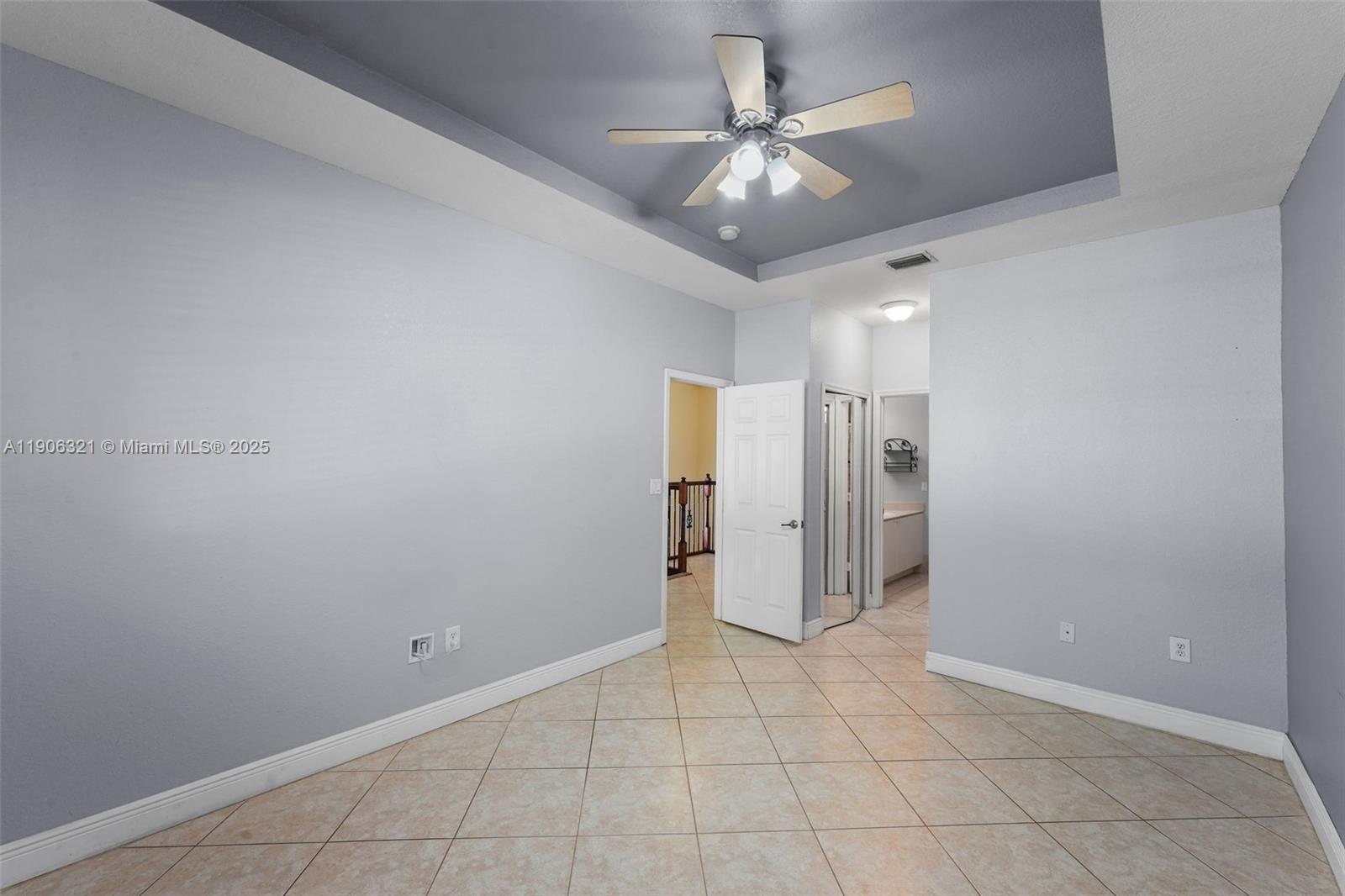 12513 Southwest 121st Way Miami, FL 33186 - Photo 24 of 37 en empty room with an empty space