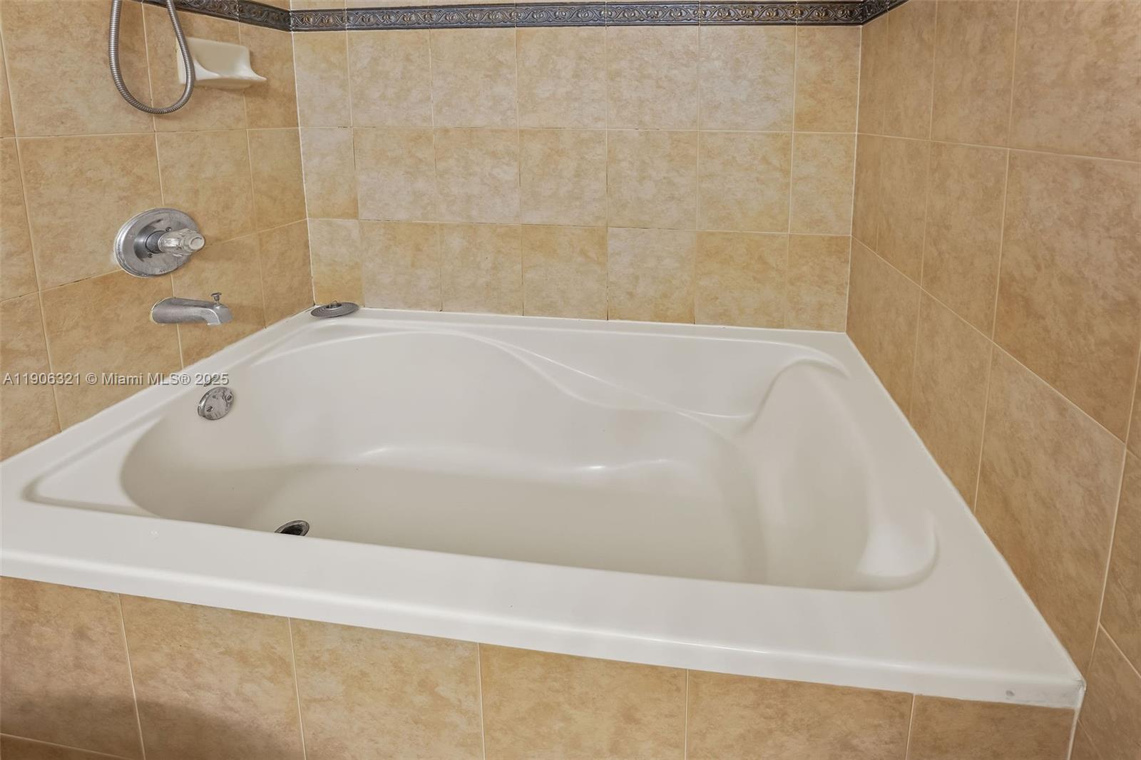 12513 Southwest 121st Way Miami, FL 33186 - Photo 25 of 37 a bathroom with a tub