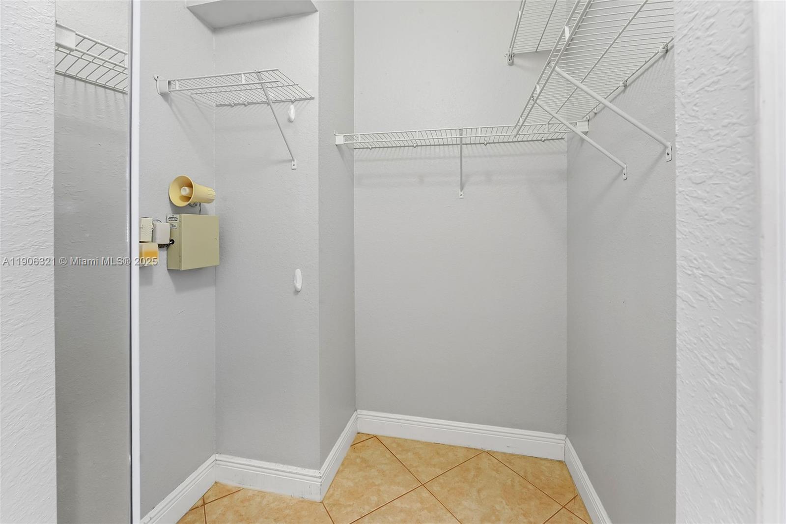 12513 Southwest 121st Way Miami, FL 33186 - Photo 26 of 37 a view of walk in closet