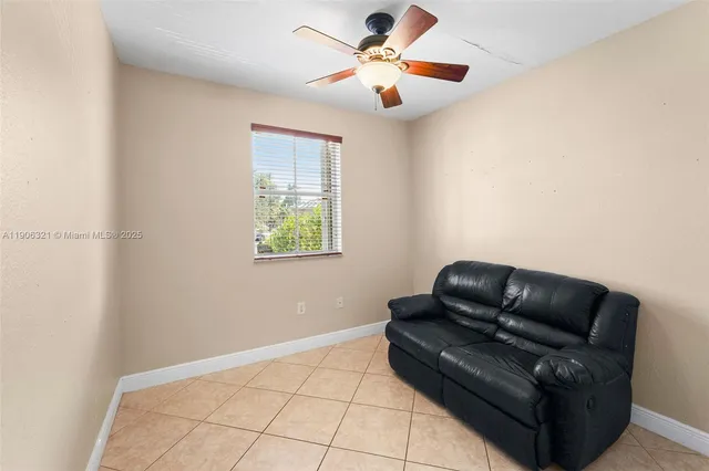 a living room with a black white checkered floor