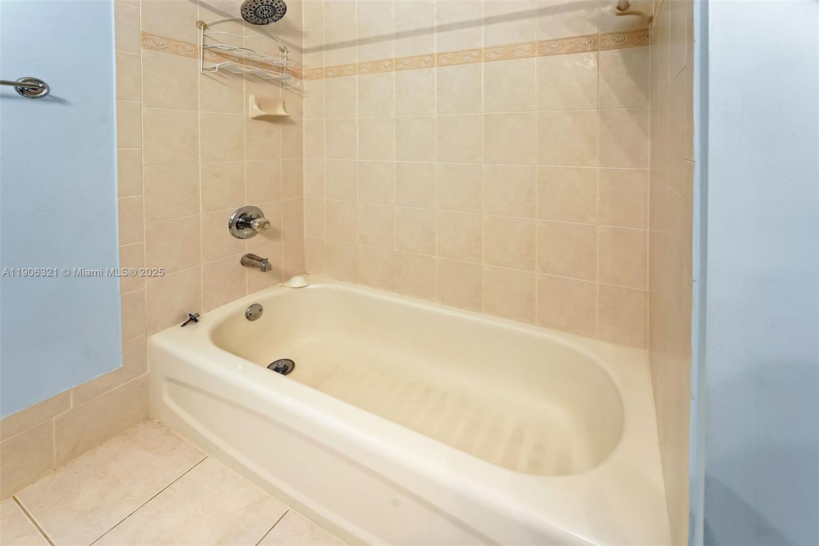 12513 Southwest 121st Way Miami, FL 33186 - Photo 35 of 37 a white bath tub and shower in a bathroom