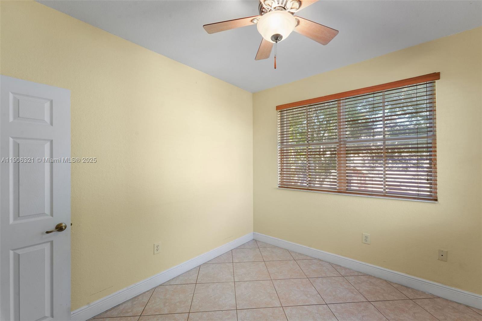 12513 Southwest 121st Way Miami, FL 33186 - Photo 36 of 37 a view of an empty room with a window