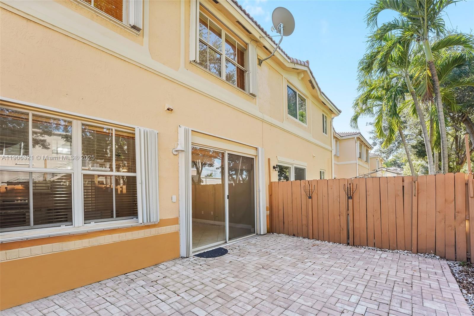 12513 Southwest 121st Way Miami, FL 33186 - Photo 5 of 37 a view of a house with a backyard