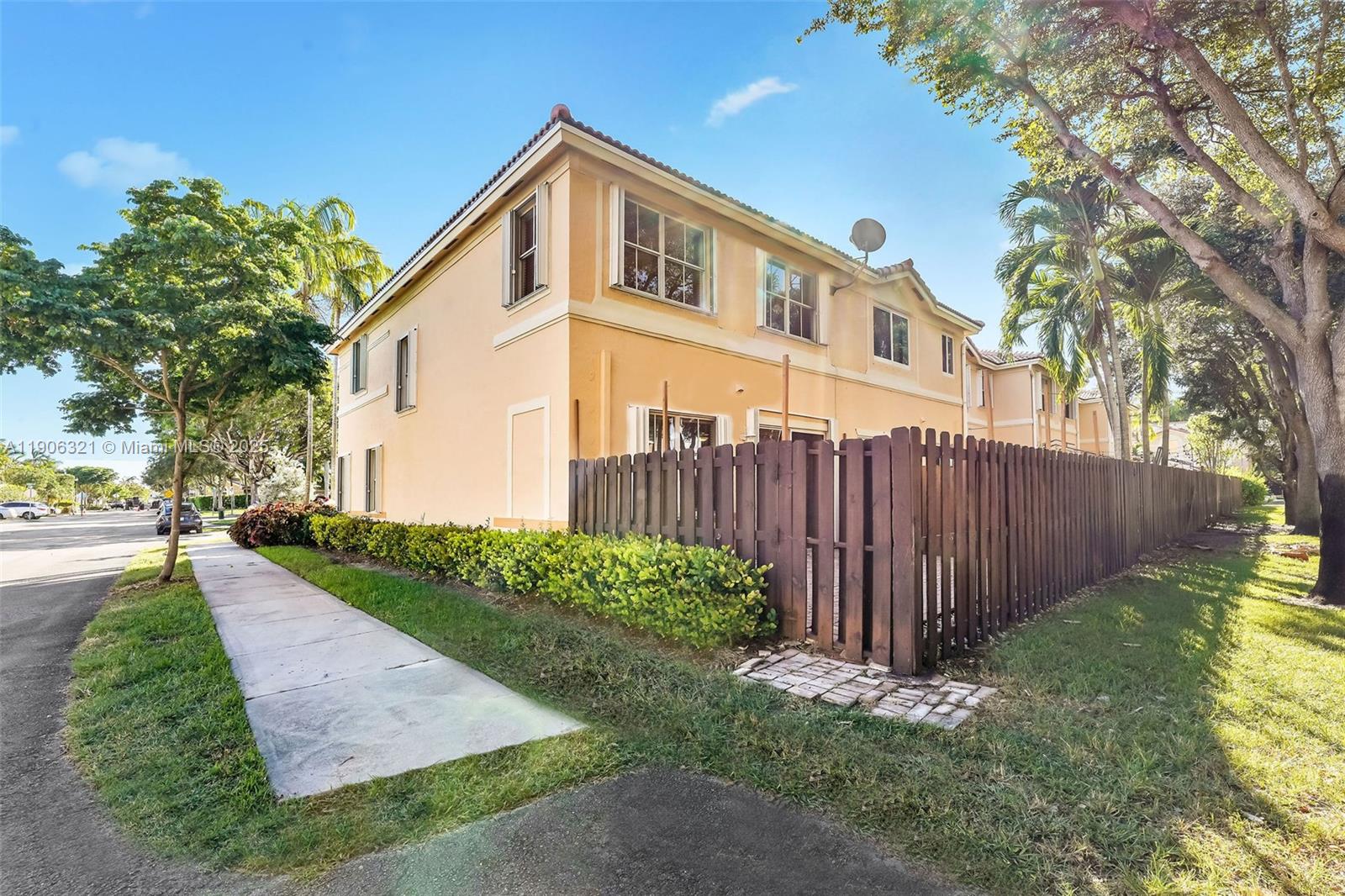 12513 Southwest 121st Way Miami, FL 33186 - Photo 6 of 37 a front view of a house with garden