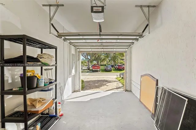 a view of hallway with furniture and a window