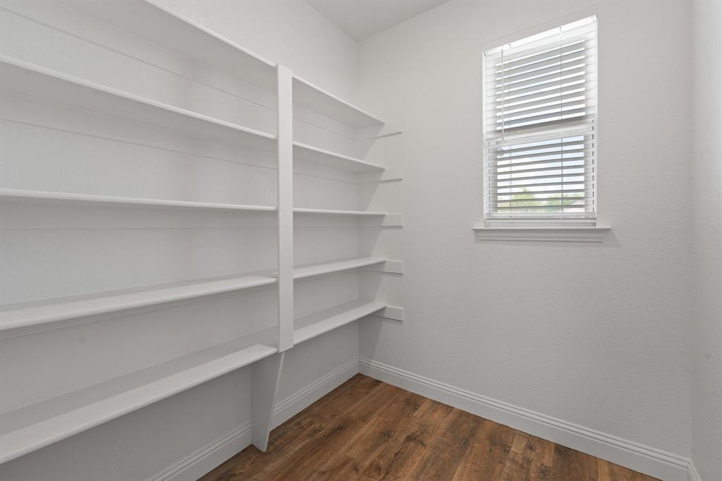 1001 Resolute Road Millsap, TX 76066 - Photo 13 of 40 a view of a room with rack on the wall
