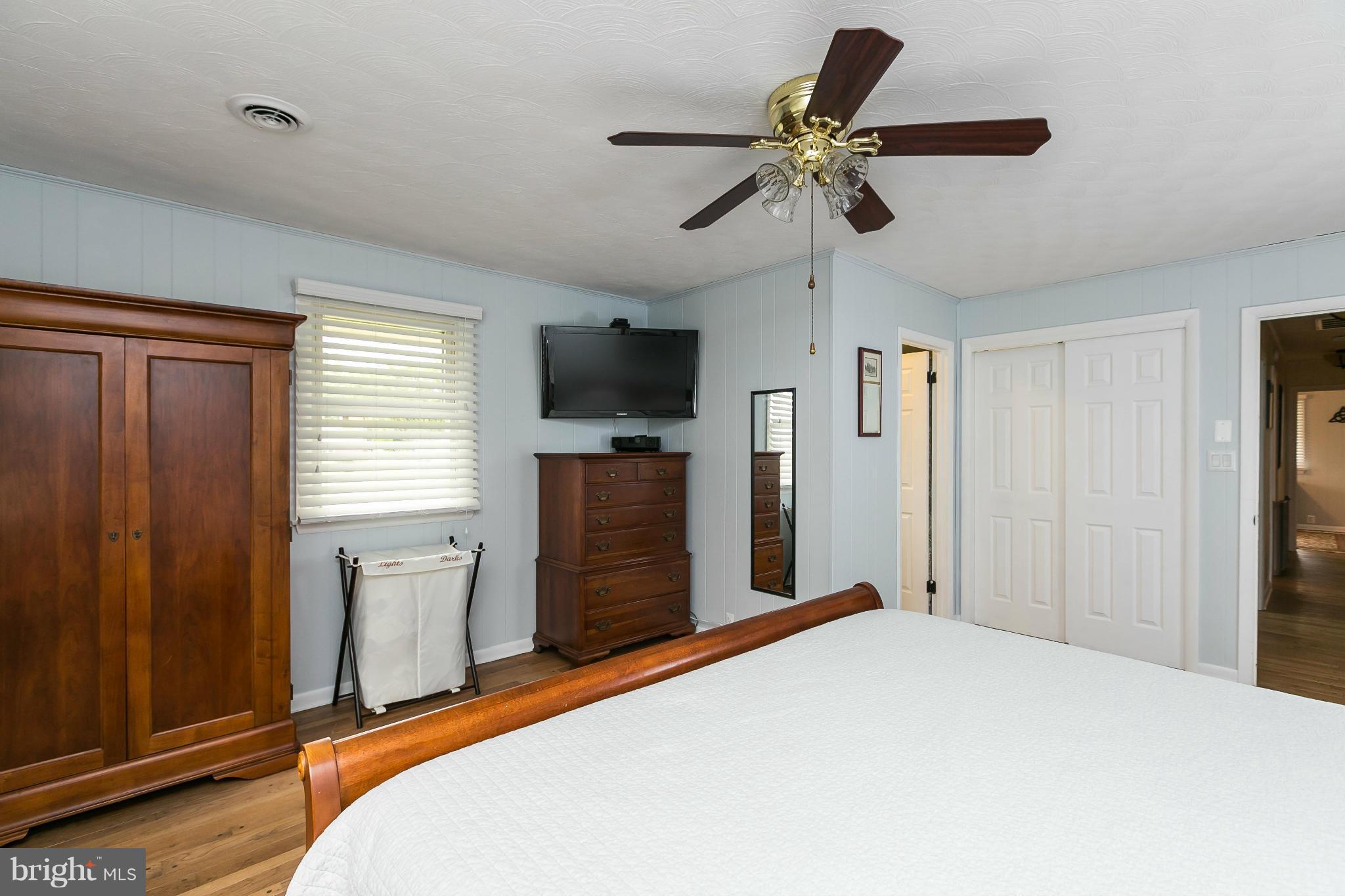 21217 Ridge Road Freeland, MD 21053 - Photo 12 of 29 a bedroom with a bed and a flat screen tv