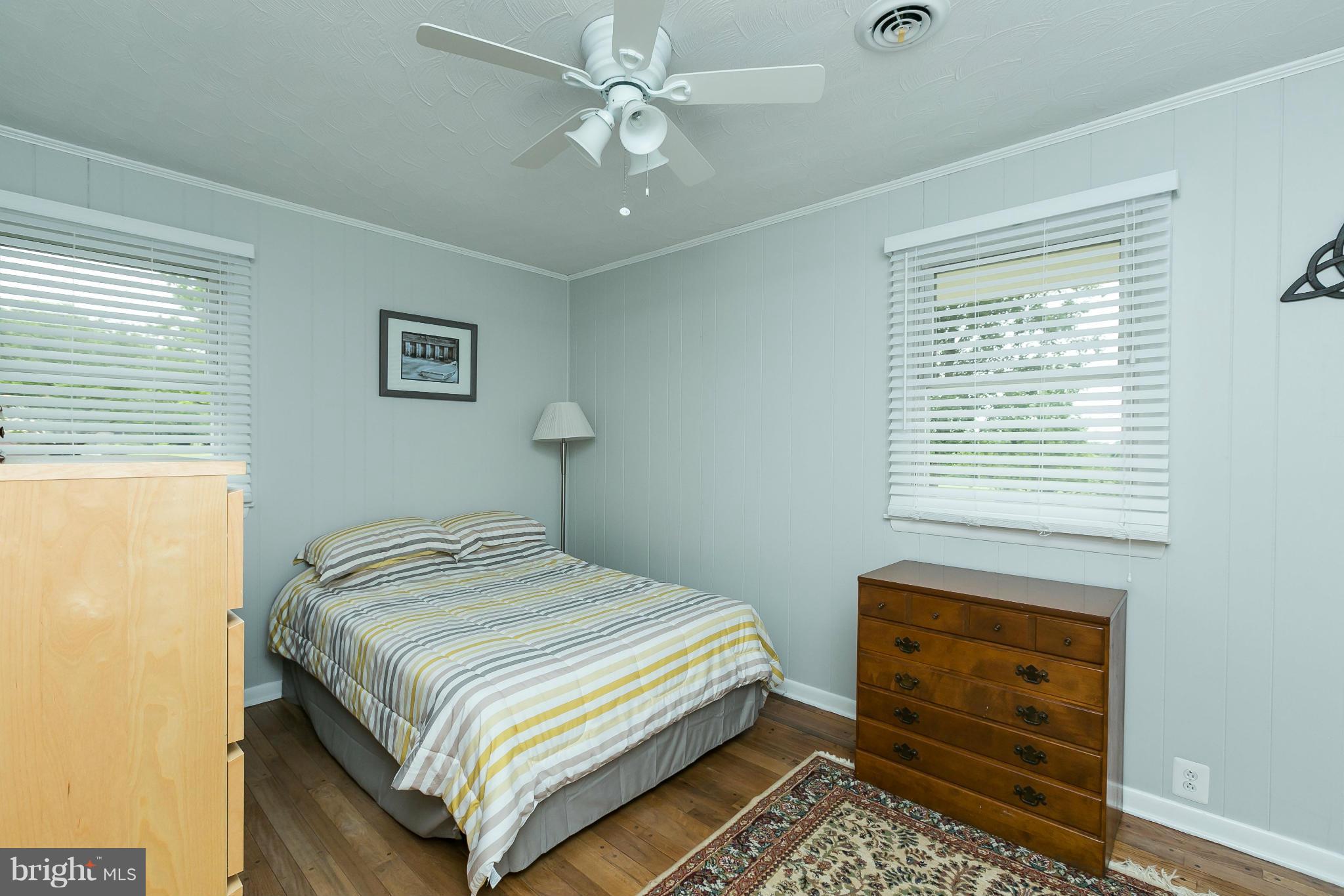 21217 Ridge Road Freeland, MD 21053 - Photo 16 of 29 a bedroom with a bed and a window