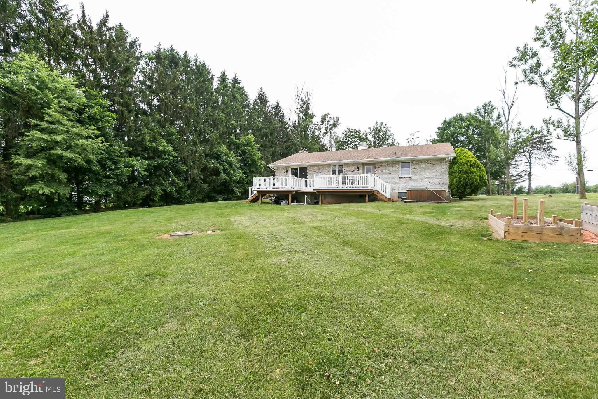 21217 Ridge Road Freeland, MD 21053 - Photo 21 of 29 a view of a house with a big yard and large trees