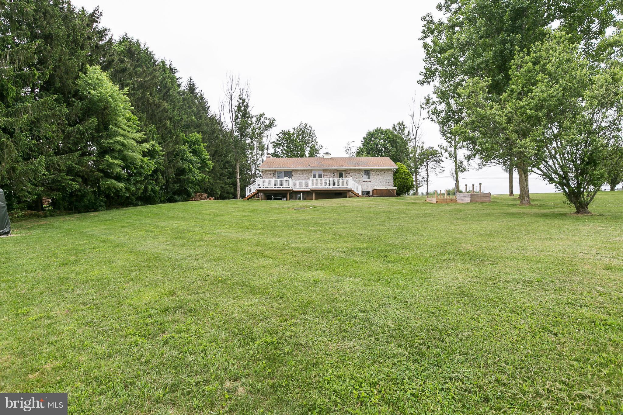 21217 Ridge Road Freeland, MD 21053 - Photo 24 of 29 a house with a garden
