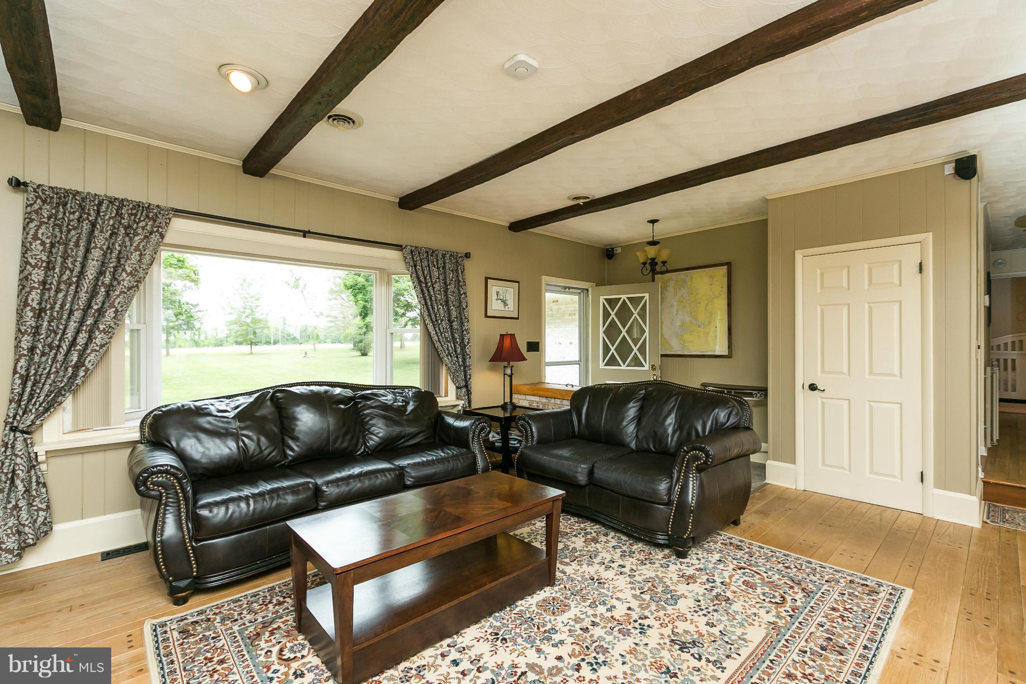 21217 Ridge Road Freeland, MD 21053 - Photo 4 of 29 a living room with furniture and a couch