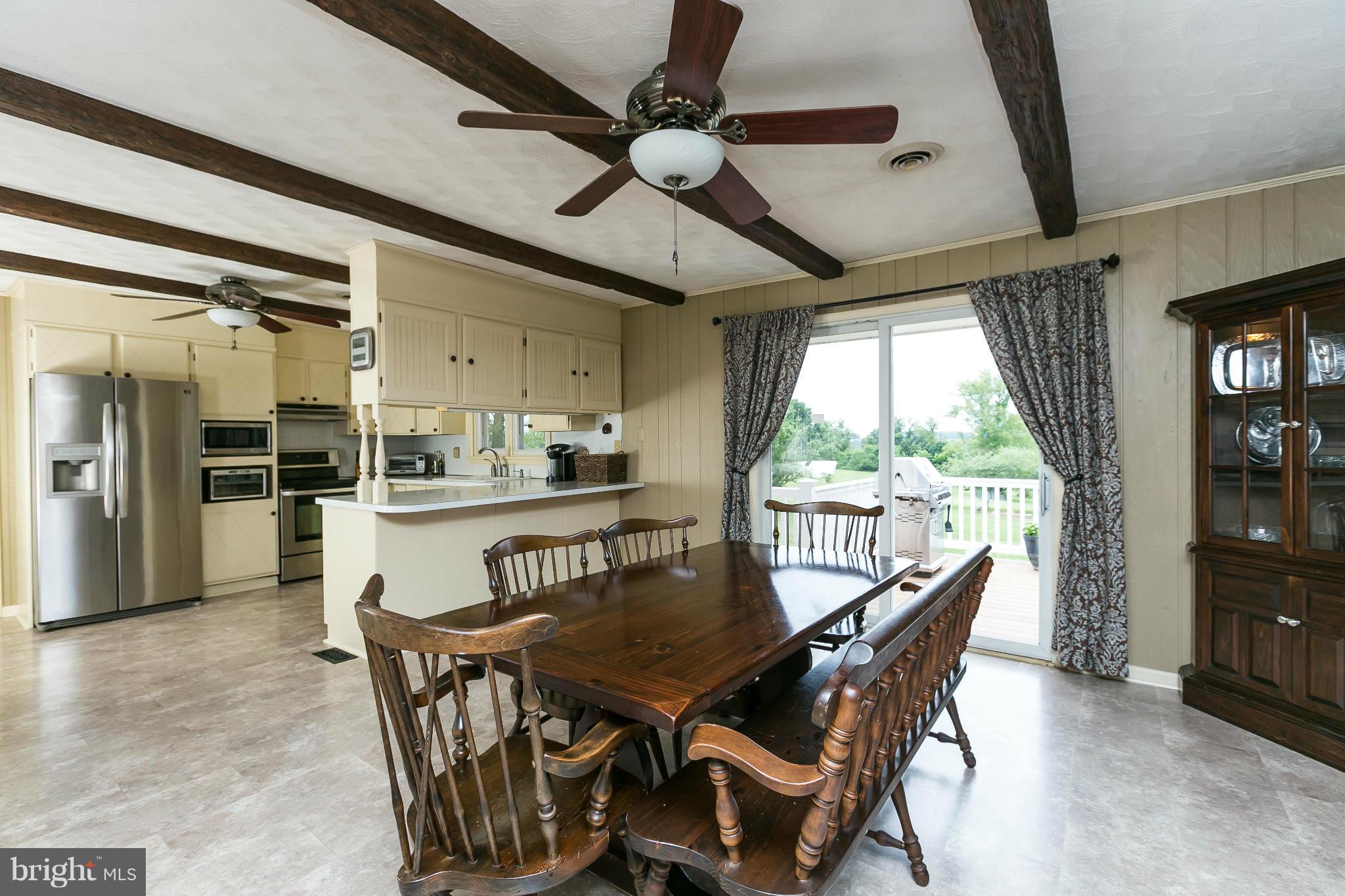 21217 Ridge Road Freeland, MD 21053 - Photo 9 of 29 a view of a dining room with furniture window and wooden floor
