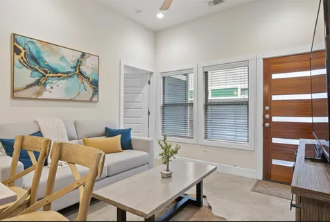 a dining room with furniture and window