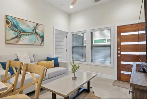 a dining room with furniture and window