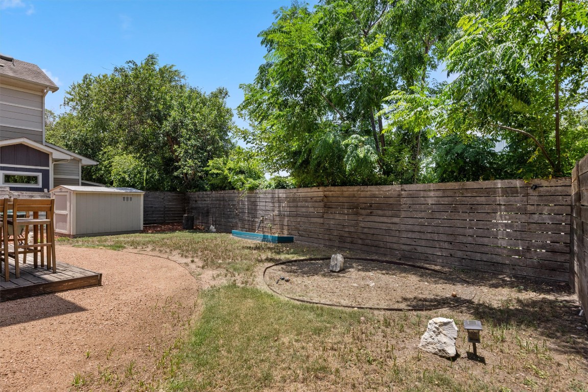 720 Pedernales Street, Unit B Austin, TX 78702 - Photo 15 of 15 a backyard of a house with table and chairs