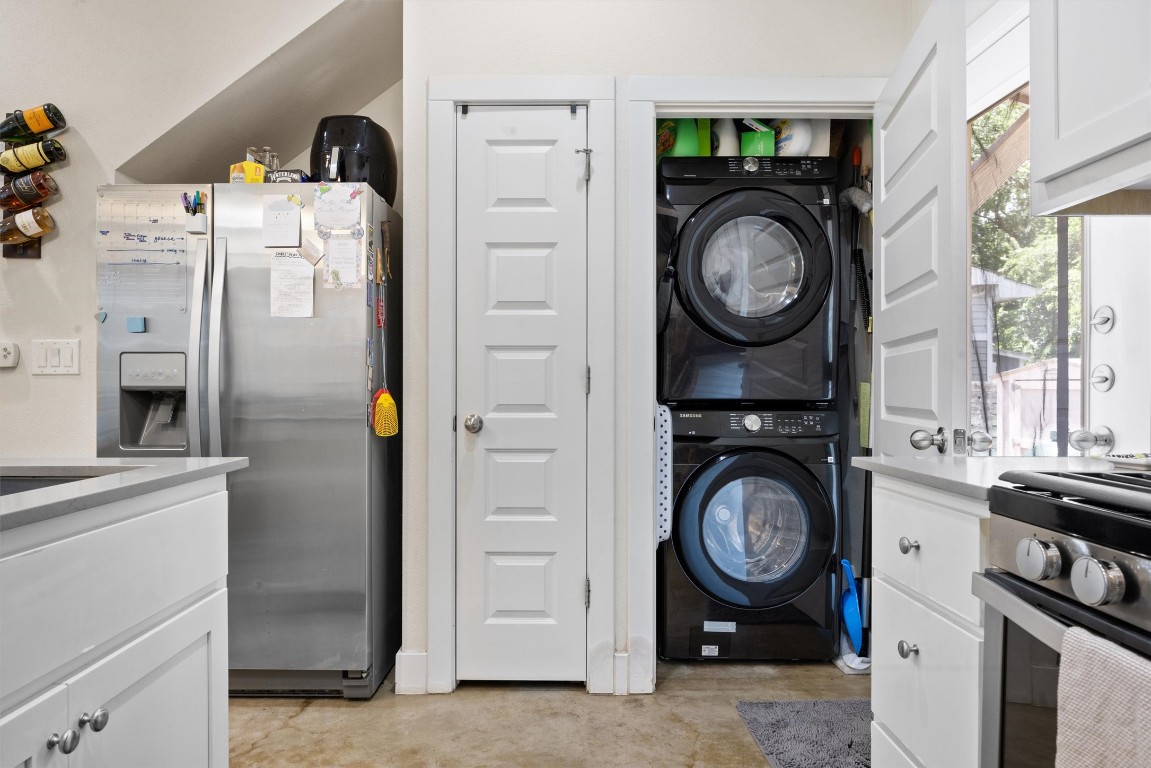 720 Pedernales Street, Unit B Austin, TX 78702 - Photo 5 of 15 a view of a storage and utility room with washer and dryer