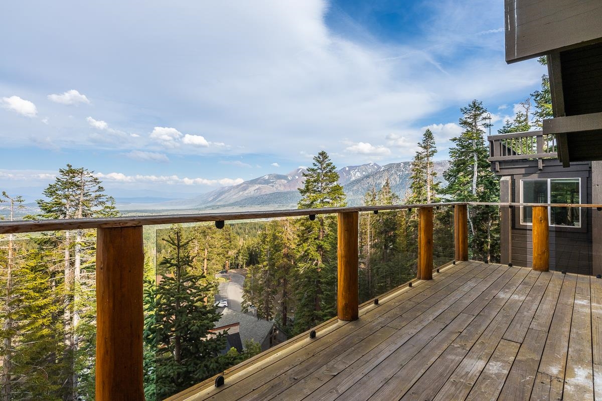 629 John Muir Road Mammoth Lakes, CA 93546 - Photo 21 of 49 a view of a balcony with chair and wooden floor