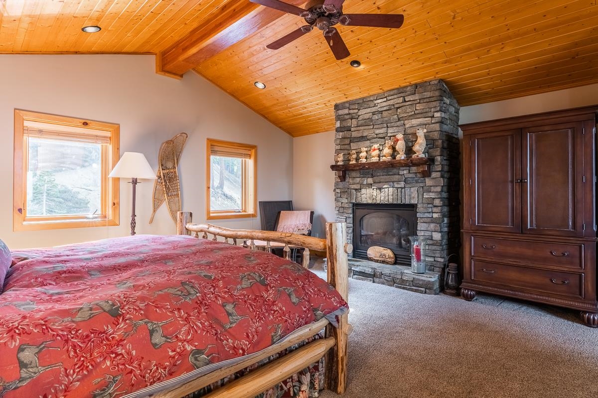 629 John Muir Road Mammoth Lakes, CA 93546 - Photo 26 of 49 a bed sitting in a room next to a window