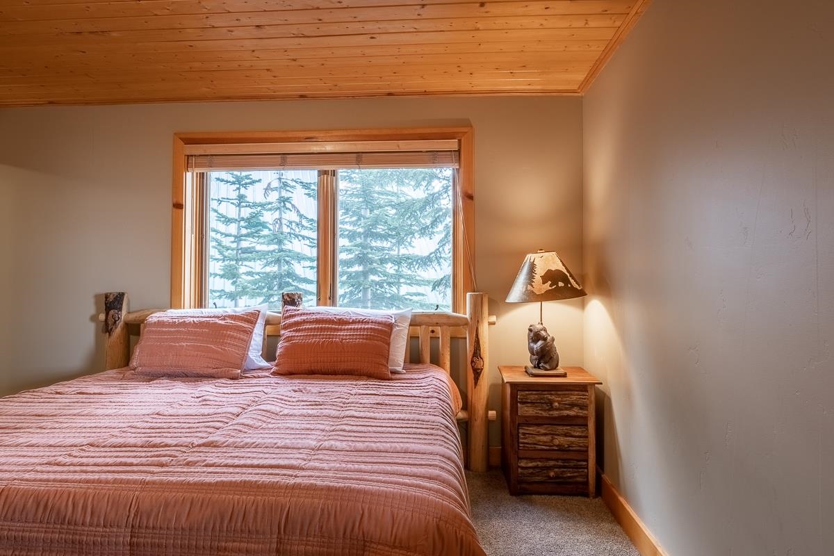 629 John Muir Road Mammoth Lakes, CA 93546 - Photo 38 of 49 a bedroom with a bed and a window