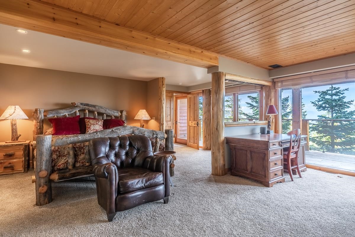629 John Muir Road Mammoth Lakes, CA 93546 - Photo 39 of 49 a bedroom with furniture and a window