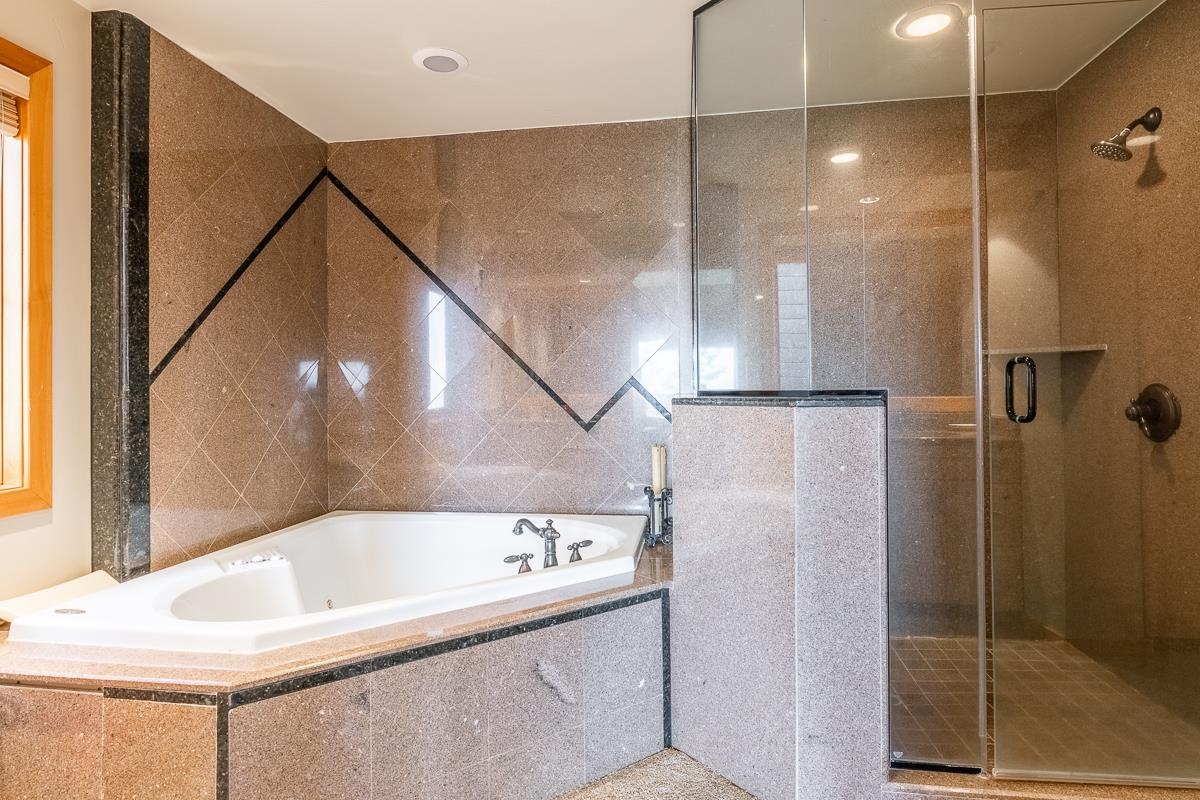 629 John Muir Road Mammoth Lakes, CA 93546 - Photo 42 of 49 a bathroom with a bathtub and a shower