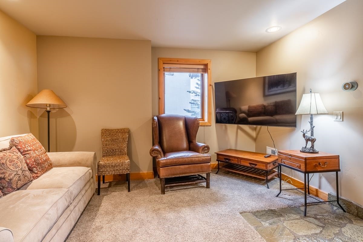 629 John Muir Road Mammoth Lakes, CA 93546 - Photo 45 of 49 a living room with furniture and a flat screen tv