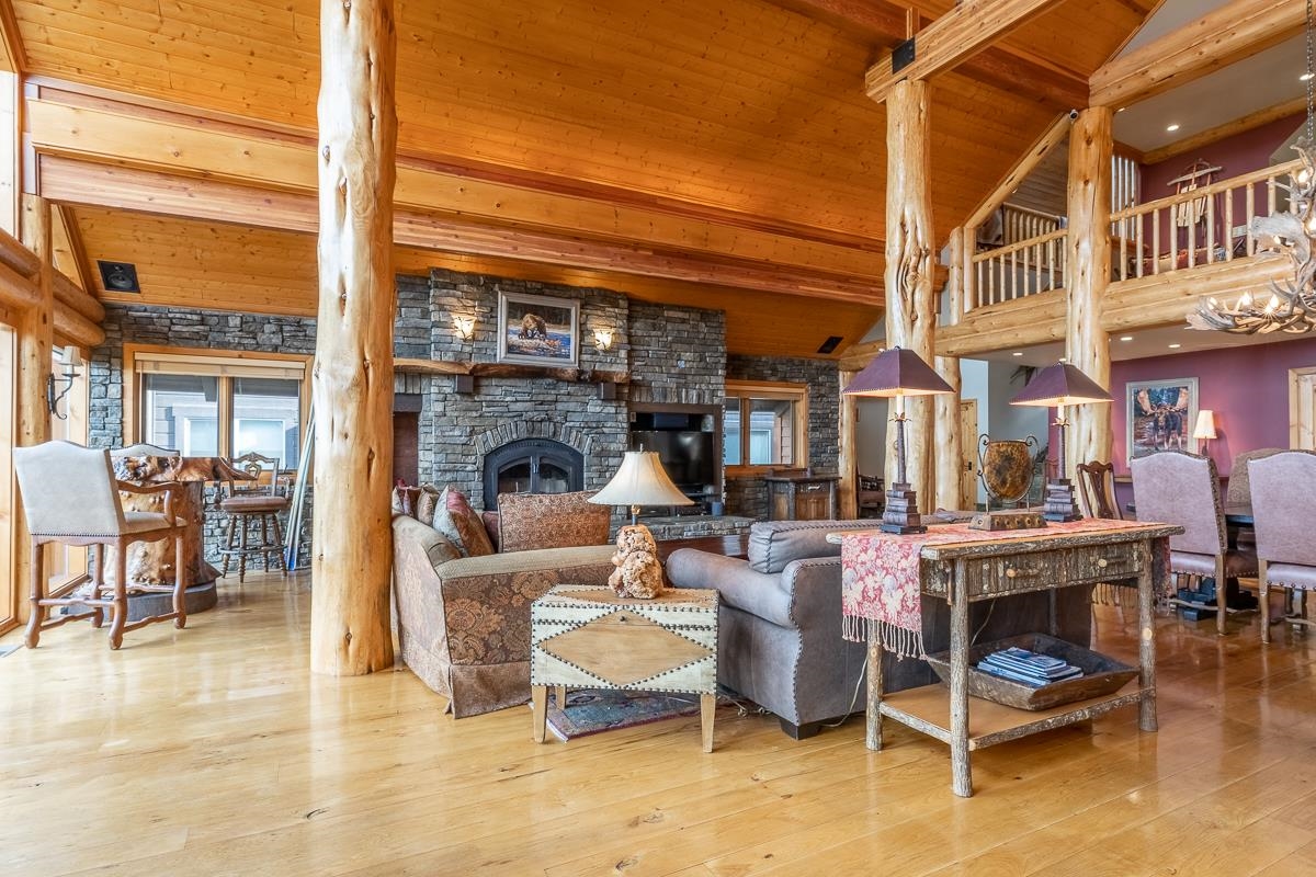 629 John Muir Road Mammoth Lakes, CA 93546 - Photo 9 of 49 a living room with fireplace furniture and a floor to ceiling window
