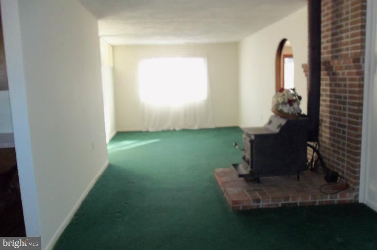 977 Grace Road Huntingtown, MD 20639 - Photo 7 of 14 a room with window and flowerpot