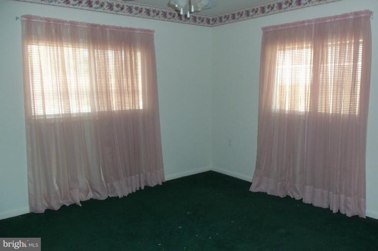 977 Grace Road Huntingtown, MD 20639 - Photo 10 of 14 a view of a room that has a window in it