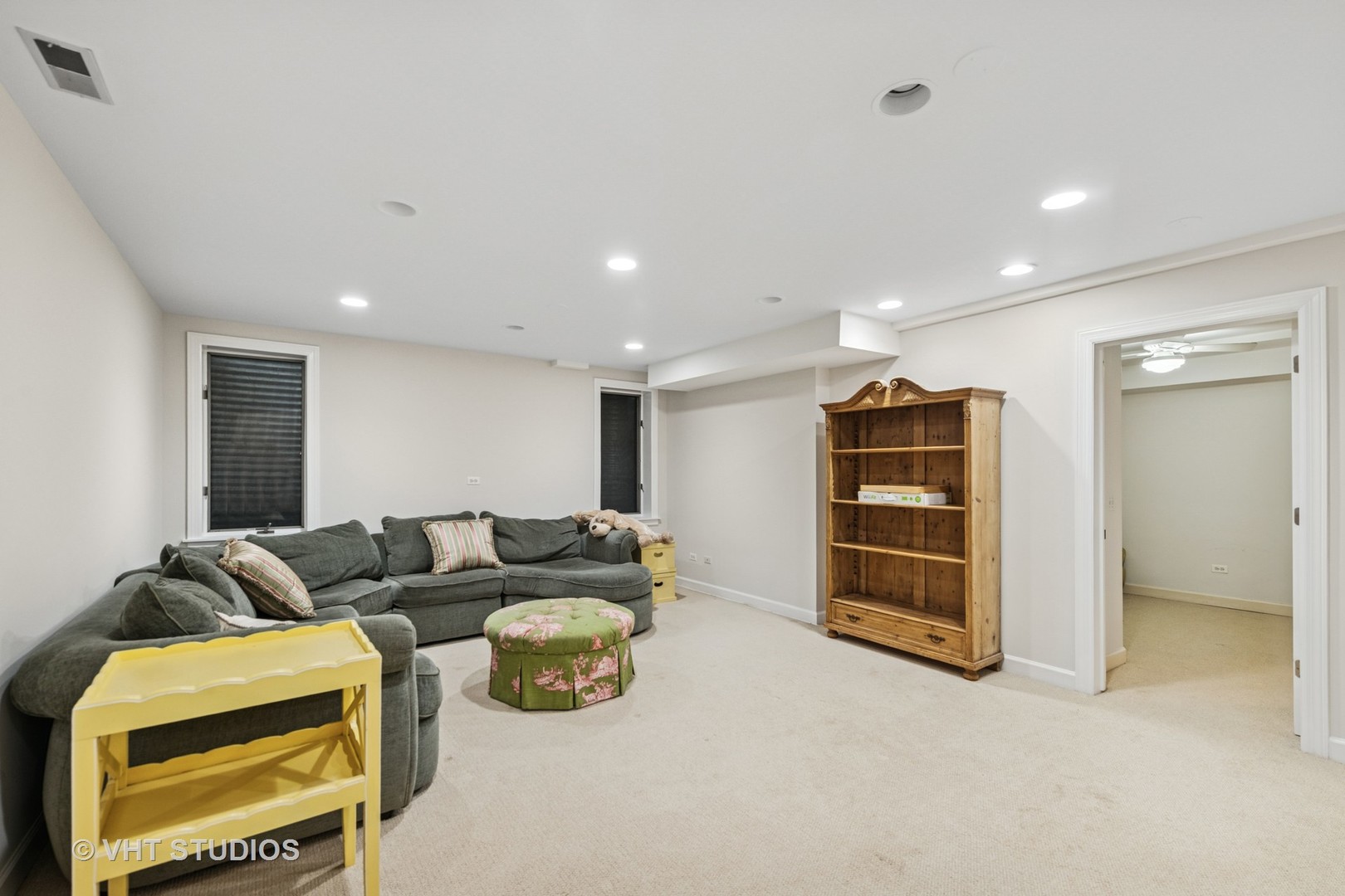 11 Longmeadow Road Winnetka, IL 60093 - Photo 24 of 31 a living room with furniture a ceiling fan and a window