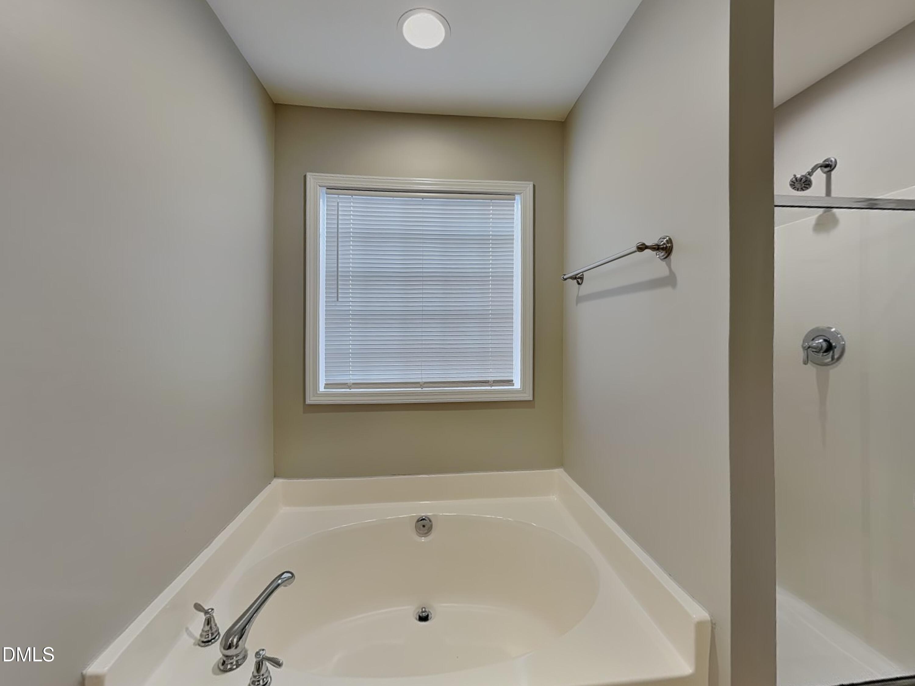 4053 Laurel Glen Drive Raleigh, NC 27610 - Photo 12 of 20 a bathroom with a bathtub