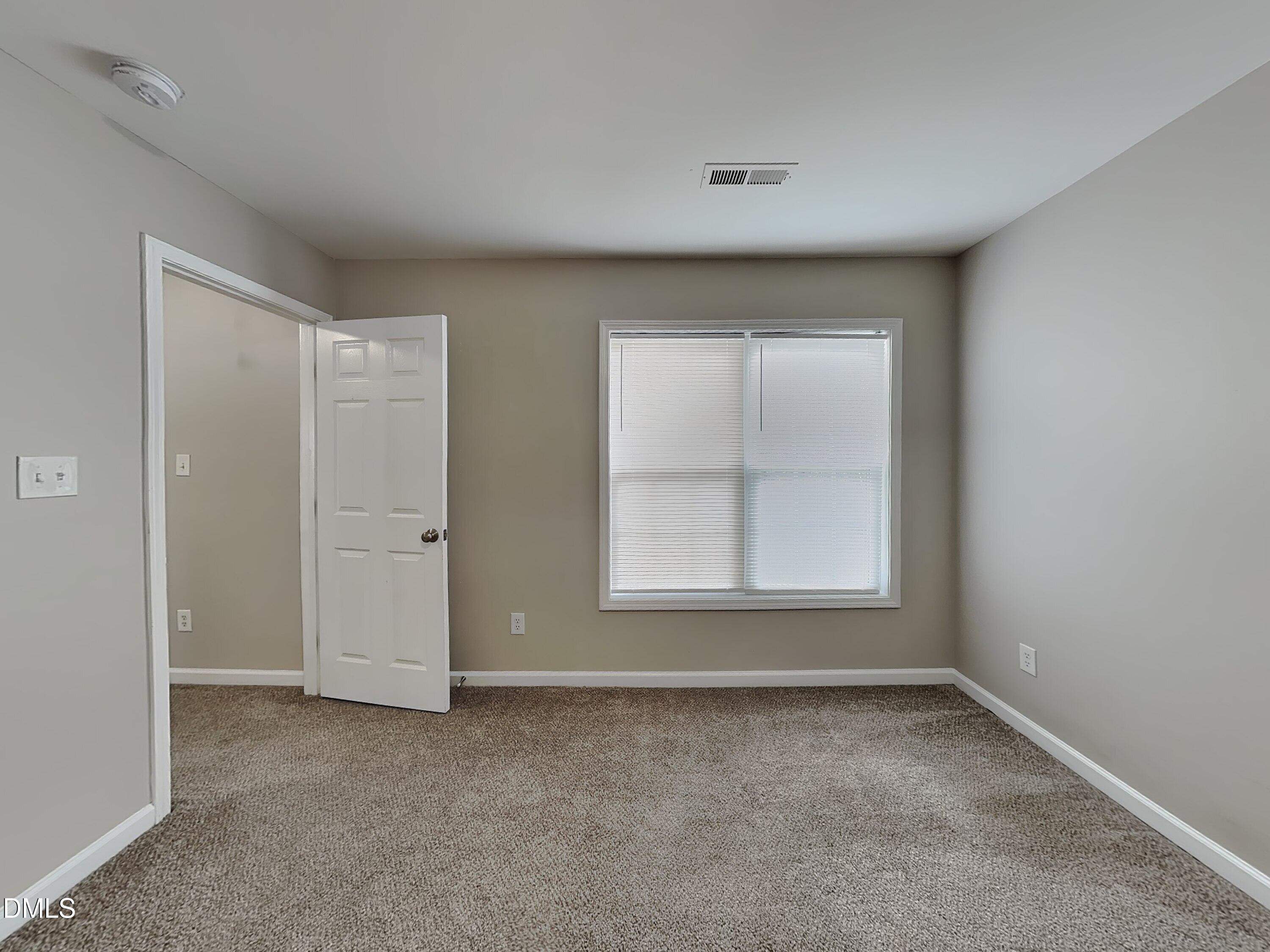 4053 Laurel Glen Drive Raleigh, NC 27610 - Photo 18 of 20 an empty room with a window