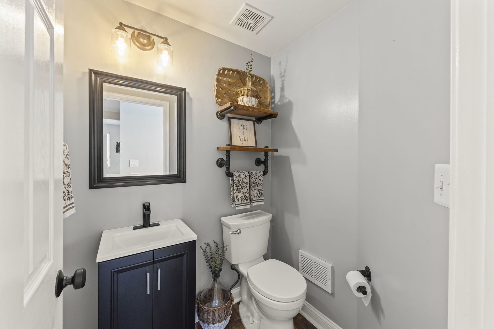 2263 Reflections Drive Aurora, IL 60502 - Photo 14 of 31 a bathroom with a toilet a sink and mirror