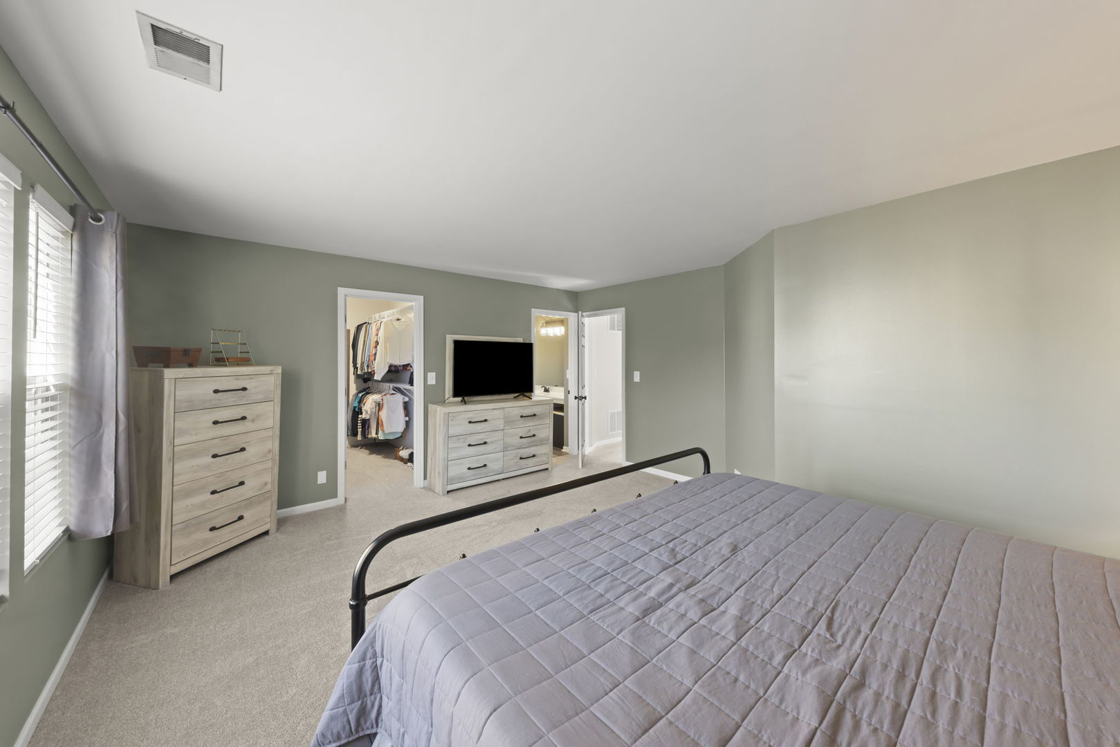 2263 Reflections Drive Aurora, IL 60502 - Photo 17 of 31 a bedroom with a bed and a television