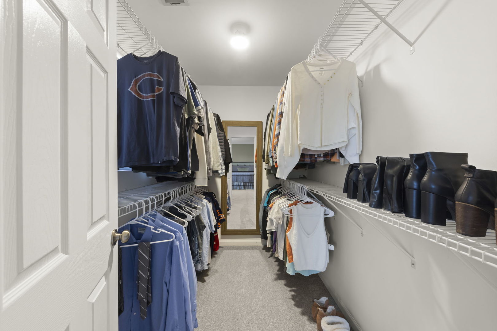 2263 Reflections Drive Aurora, IL 60502 - Photo 18 of 31 a view of walk in closet with clothes and shoes