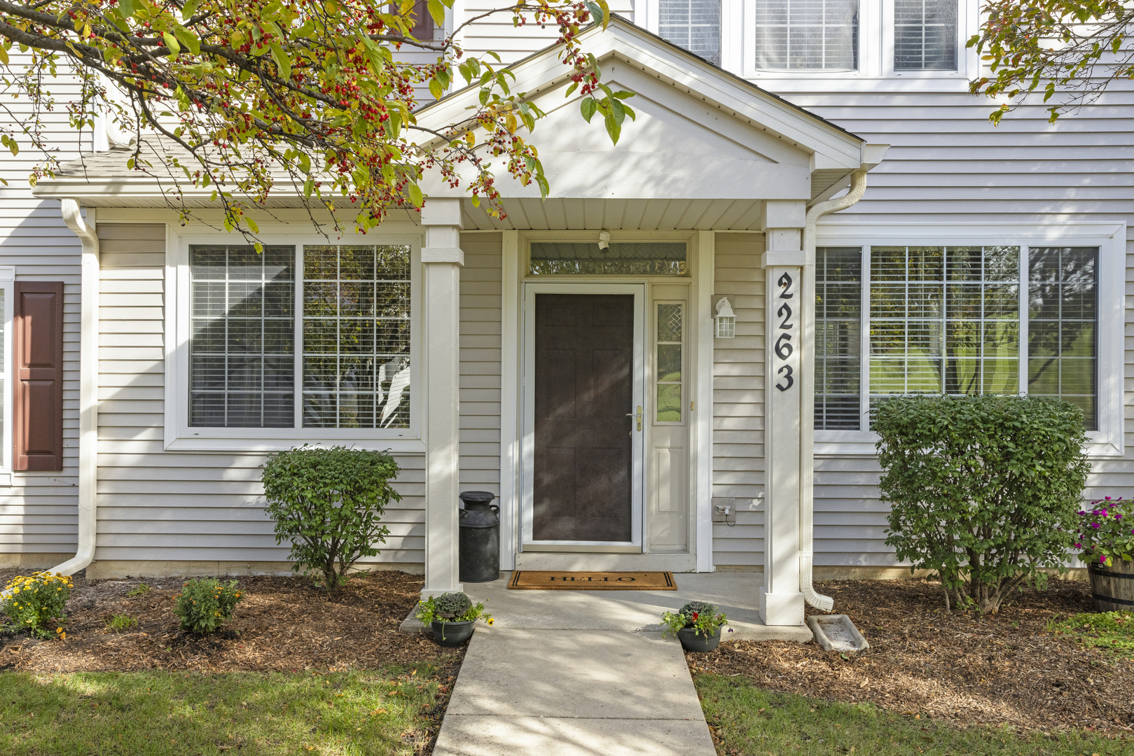 2263 Reflections Drive Aurora, IL 60502 - Photo 2 of 31 a front view of a house with a yard