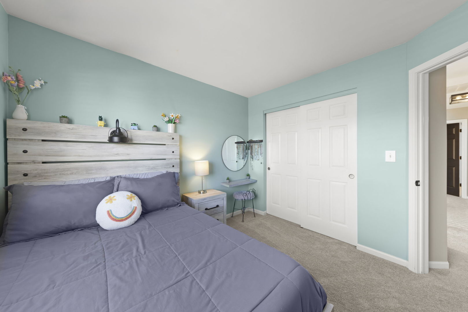 2263 Reflections Drive Aurora, IL 60502 - Photo 21 of 31 a bedroom with a bed and a chandelier