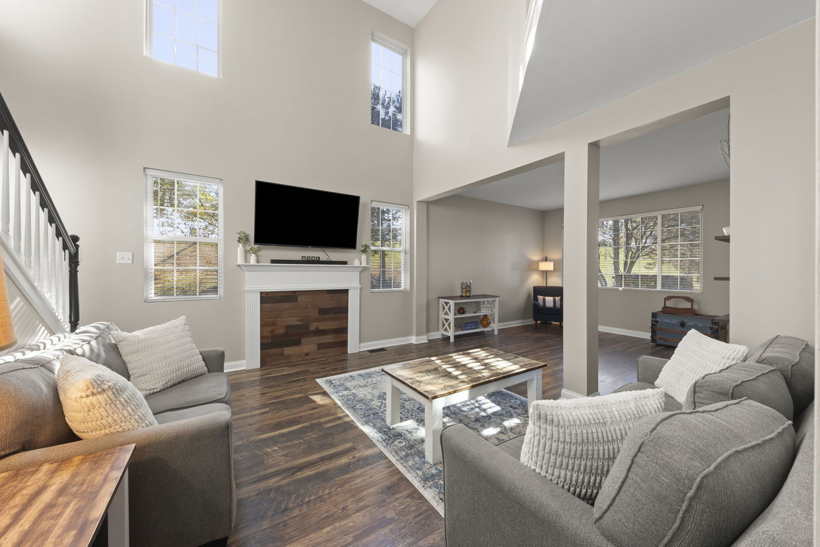 2263 Reflections Drive Aurora, IL 60502 - Photo 5 of 31 a living room with furniture a fireplace and a flat screen tv