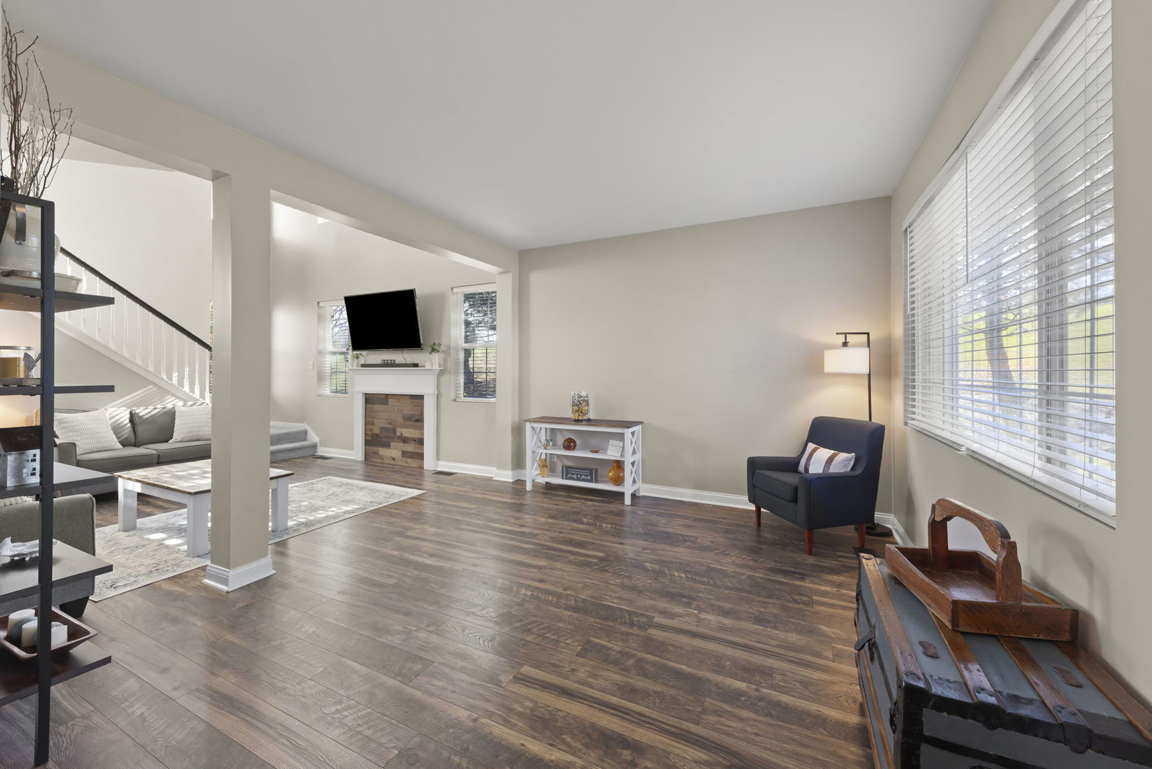 2263 Reflections Drive Aurora, IL 60502 - Photo 7 of 31 a living room with furniture a flat screen tv and wooden floor