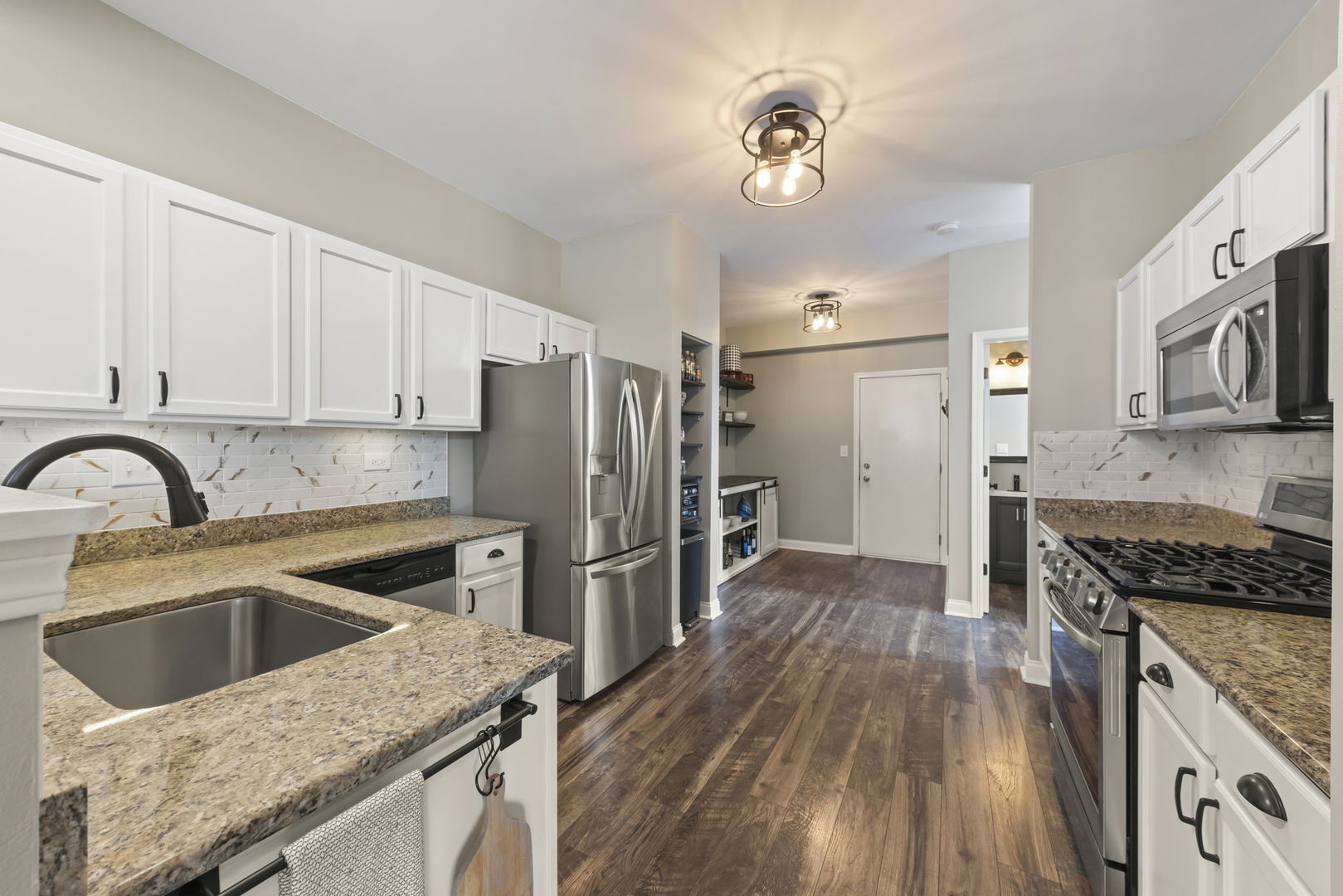 2263 Reflections Drive Aurora, IL 60502 - Photo 9 of 31 a kitchen with a stove a sink and a refrigerator