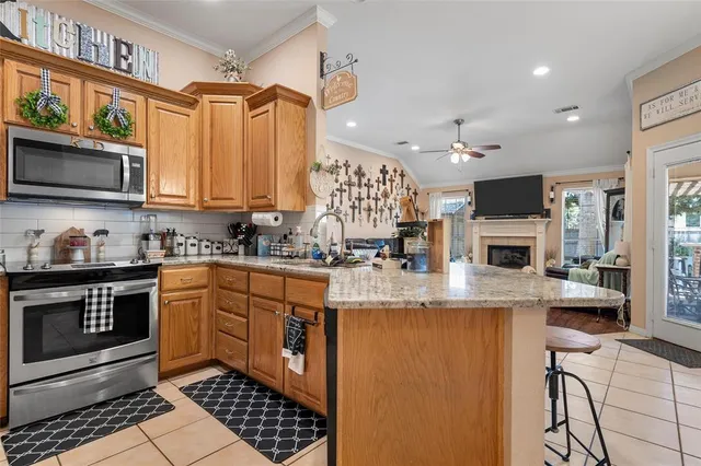 a kitchen with stainless steel appliances granite countertop a stove and a sink