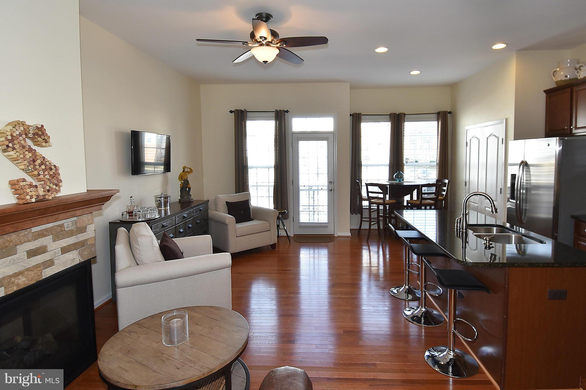 22641 Twitter Square Ashburn, VA 20148 - Photo 12 of 30 Light filled Family Rm w/ hardwood flooring